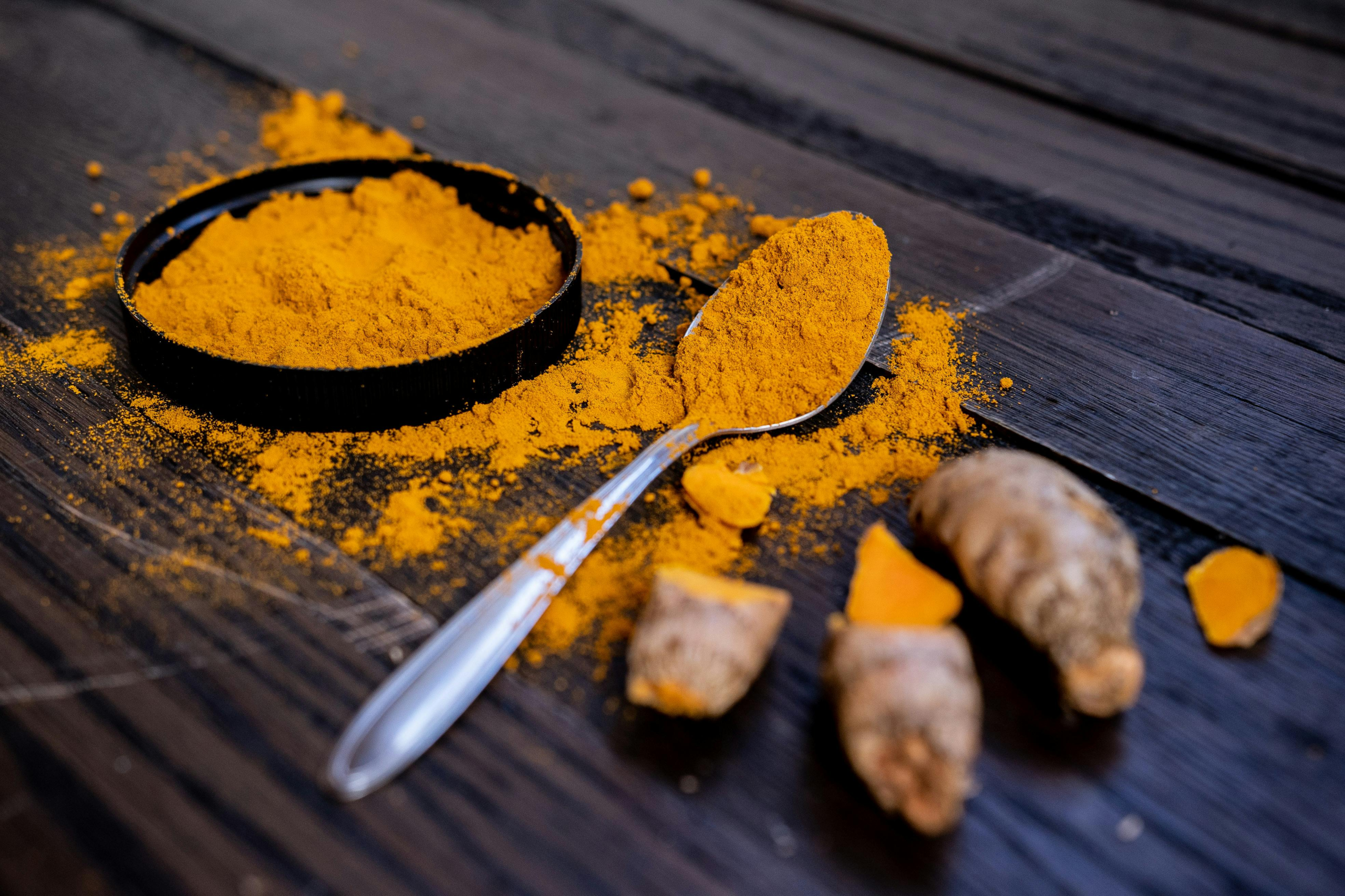 Turmeric image with turmeric powder and roots